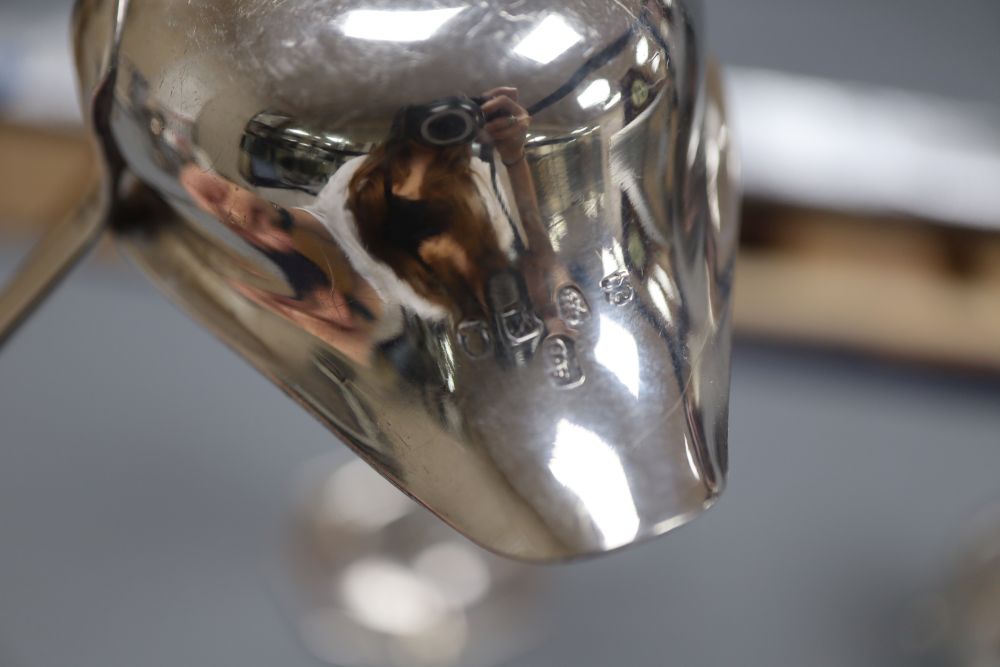 A Victorian engraved silver cream jug, Richards & Brown, London, 1869, toddy ladle and candlestick.